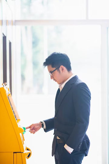businessman-withdraw-cash-atm-machine_39704-2499